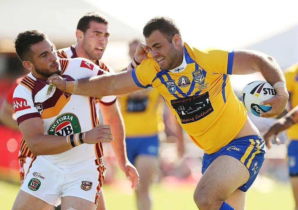 WAGGA WAGGA, AUSTRALIA - MAY 03: Wade Graham of City fends off a tackle during the City v Country Origin match at McDonalds Park on May 3, 2015 in Wagga Wagga, Australia. (Photo by Stefan Postles/Getty Images)