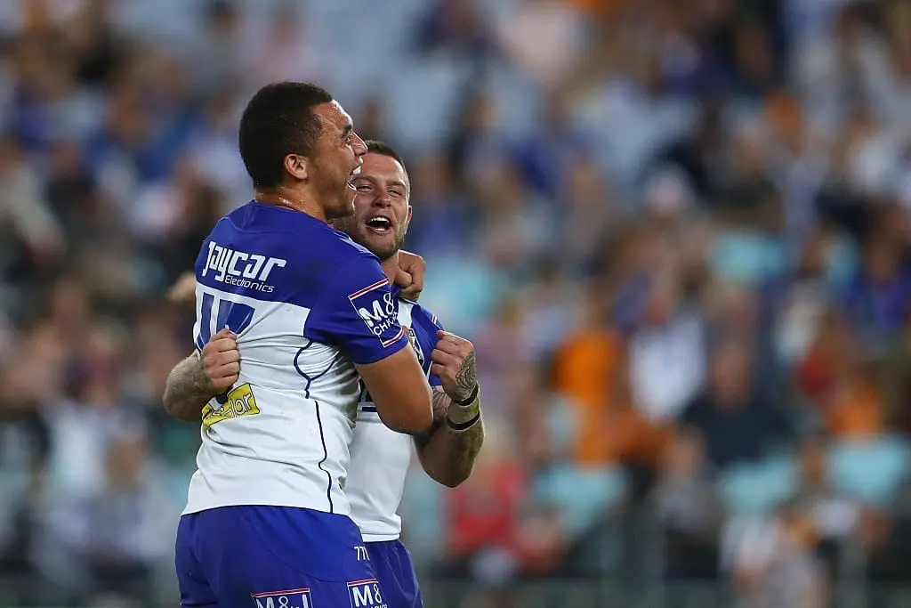 SYDNEY, AUSTRALIA - MAY 15: Raymond Faitala-Mariner and Craig Garvey of the Bulldogs celebrate victory during the round 10 NRL match between the Wests Tigers and the Canterbury Bulldogs at ANZ Stadium on May 15, 2016 in Sydney, Australia. (Photo by Mark Kolbe/Getty Images)