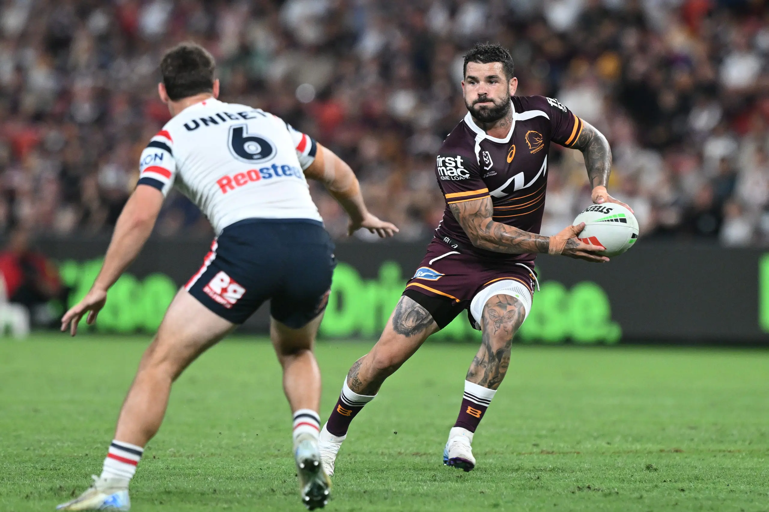 BRISBANE, AUSTRALIA - APRIL 11: Adam Reynolds of the Broncos passes during the round six NRL match between Brisbane Broncos and Sydney Roosters at Suncorp Stadium, on April 11, 2025, in Brisbane, Australia. (Photo by Bradley Kanaris/Getty Images)
