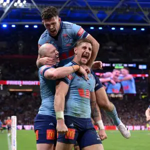 BRISBANE, AUSTRALIA - MAY 28: Zac Lomax of the Blues celebrates with team mates after scoring a try during game one of the Men's State of Origin series between Queensland Maroons and New South Wales Blues at Suncorp Stadium on May 28, 2025 in Brisbane, Australia. (Photo by Bradley Kanaris/Getty Images)
