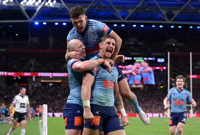 BRISBANE, AUSTRALIA - MAY 28: Zac Lomax of the Blues celebrates with team mates after scoring a try during game one of the Men's State of Origin series between Queensland Maroons and New South Wales Blues at Suncorp Stadium on May 28, 2025 in Brisbane, Australia. (Photo by Bradley Kanaris/Getty Images)