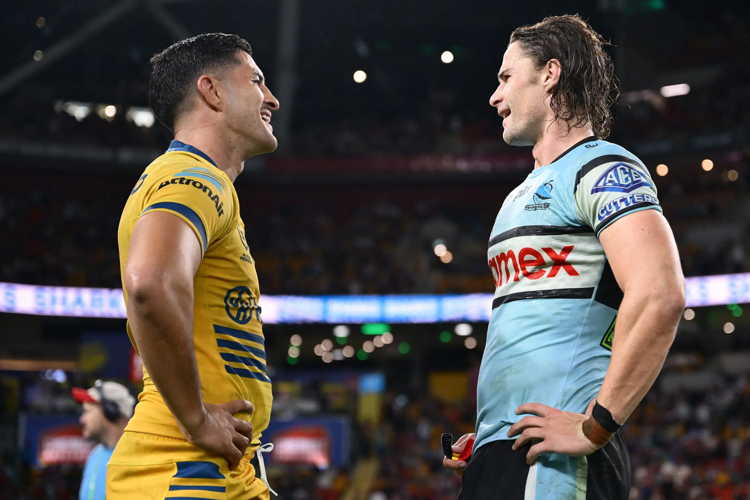 BRISBANE, AUSTRALIA - MAY 02: Dylan Brown of the Eels and Nicho Hynes of the Sharks talk to each other after the round nine NRL match between the Cronulla Sharks and Parramatta Eels at Suncorp Stadium on May 02, 2025, in Brisbane, Australia. (Photo by Hannah Peters/Getty Images)