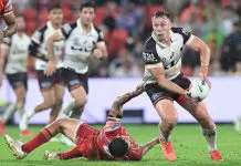 BRISBANE, AUSTRALIA - MARCH 28: Billy Walters of the Broncos is tackled during the round four NRL match between Dolphins and Brisbane Broncos at Suncorp Stadium, on March 28, 2025, in Brisbane, Australia. (Photo by Bradley Kanaris/Getty Images)