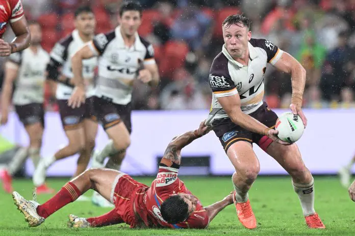 BRISBANE, AUSTRALIA - MARCH 28: Billy Walters of the Broncos is tackled during the round four NRL match between Dolphins and Brisbane Broncos at Suncorp Stadium, on March 28, 2025, in Brisbane, Australia. (Photo by Bradley Kanaris/Getty Images)