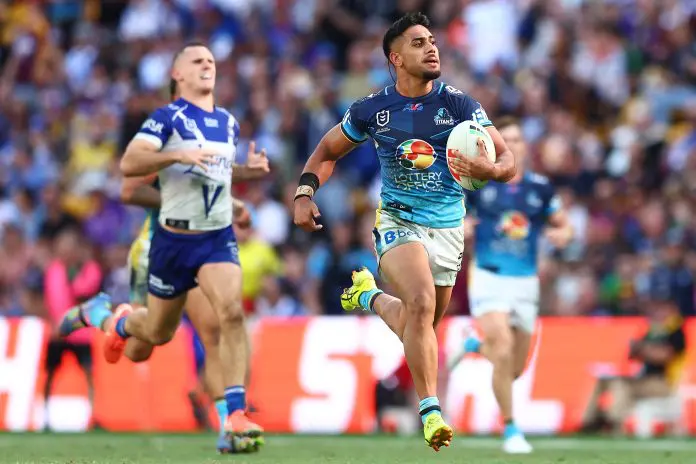 BRISBANE, AUSTRALIA - MAY 04: Alofiana Khan-Pereira of the Titans makes a break to score a try during the round nine NRL match between the Gold Coast Titans and Canterbury Bulldogs at Suncorp Stadium on May 04, 2025, in Brisbane, Australia. (Photo by Chris Hyde/Getty Images)