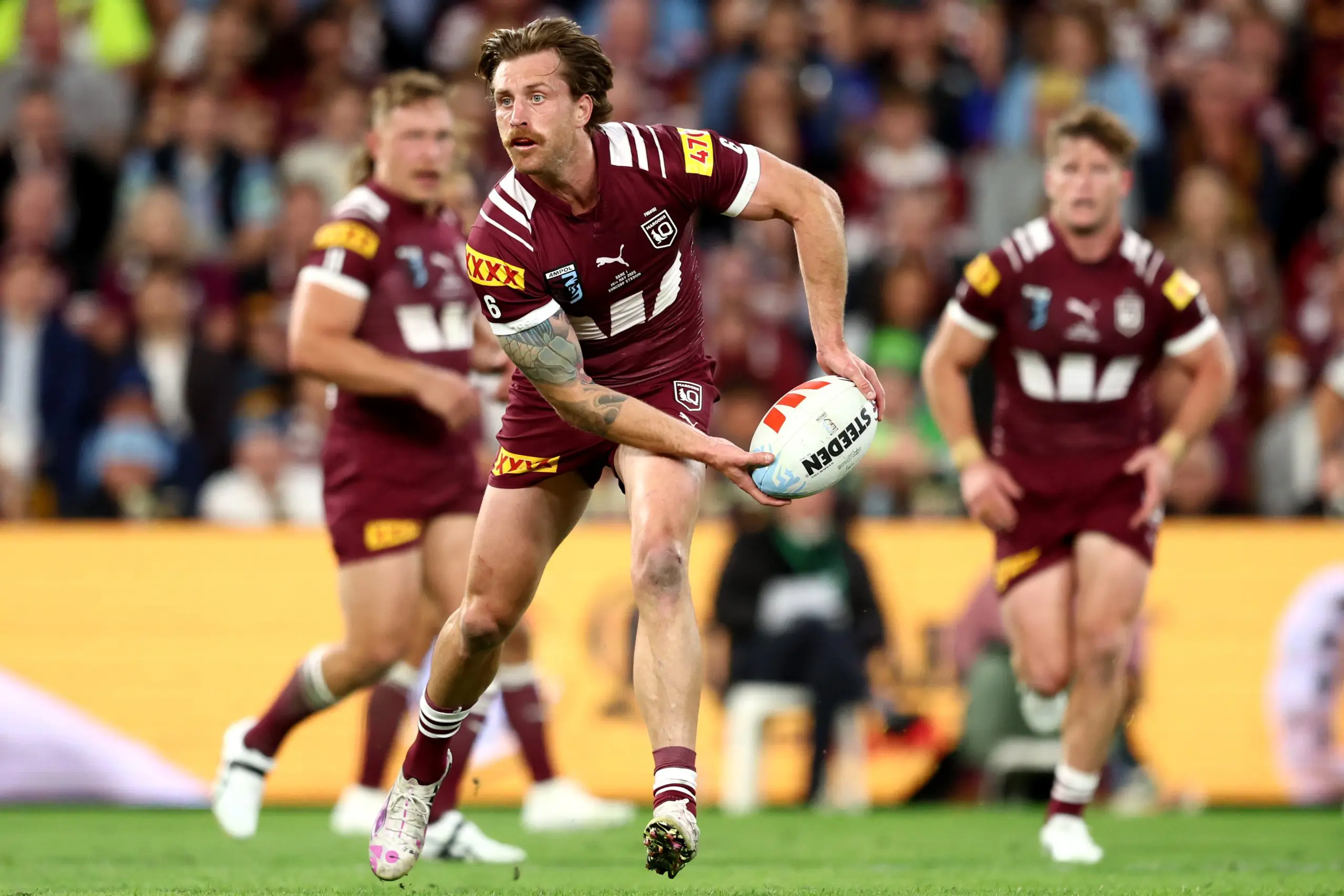 BRISBANE, AUSTRALIA - MAY 28: Cameron Munster of the Maroons looks to pass the ball during game one of the Men's State of Origin series between Queensland Maroons and New South Wales Blues at Suncorp Stadium on May 28, 2025 in Brisbane, Australia. (Photo by Chris Hyde/Getty Images)