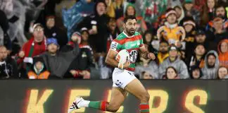 SYDNEY, AUSTRALIA - MAY 18: Alex Johnston of the Rabbitohs makes a break during the round eleven NRL match between Wests Tigers and Rabbitohs at Campbelltown Sports Stadium, on May 18, 2025, in Sydney, Australia. (Photo by Cameron Spencer/Getty Images)