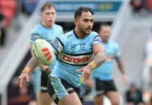 BRISBANE, AUSTRALIA - JUNE 22: Hohepa Puru of the Sharks passes the ball during the round 16 NRL match between Brisbane Broncos and Cronulla Sharks at Suncorp Stadium, on June 22, 2025, in Brisbane, Australia. (Photo by Bradley Kanaris/Getty Images)
