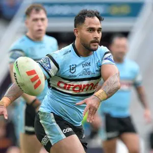 BRISBANE, AUSTRALIA - JUNE 22: Hohepa Puru of the Sharks passes the ball during the round 16 NRL match between Brisbane Broncos and Cronulla Sharks at Suncorp Stadium, on June 22, 2025, in Brisbane, Australia. (Photo by Bradley Kanaris/Getty Images)