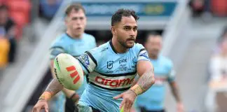 BRISBANE, AUSTRALIA - JUNE 22: Hohepa Puru of the Sharks passes the ball during the round 16 NRL match between Brisbane Broncos and Cronulla Sharks at Suncorp Stadium, on June 22, 2025, in Brisbane, Australia. (Photo by Bradley Kanaris/Getty Images)