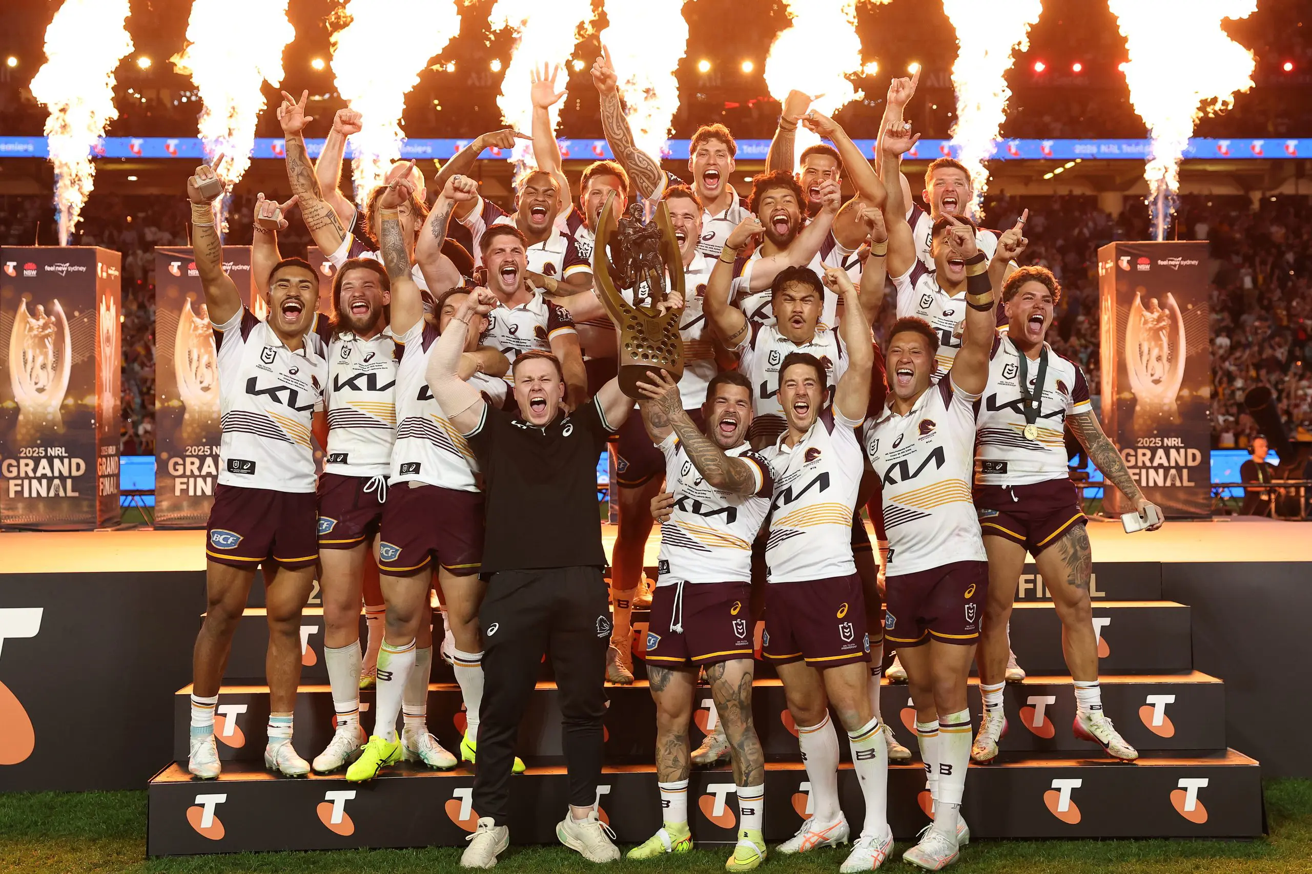 SYDNEY, AUSTRALIA - OCTOBER 05: Adamย Reynolds and Billy Walters of the Broncos hold aloft the Provan-Summons Trophy as the team celebrates after winning the NRL Grand Final match between the Melbourne Storm at Brisbane Broncos at Accor Stadium on October 05, 2025, in Sydney, Australia. (Photo by Cameron Spencer/Getty Images)