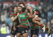 SYDNEY, AUSTRALIA - MAY 09: Latrell Mitchell of the Rabbitohs celebrates with team mates after kicking a two-point field goal during the round 10 NRL match between the South Sydney Rabbitohs and Brisbane Broncos at Accor Stadium on May 09, 2025, in Sydney, Australia. (Photo by Darrian Traynor/Getty Images)