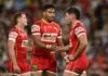 BRISBANE, AUSTRALIA - MARCH 27: Jake Averillo of the Dolphins celebrates with Selwyn Cobbo after scoring a try during the round four NRL match between Brisbane Broncos and Dolphins at Suncorp Stadium, on March 27, 2026, in Brisbane, Australia. (Photo by Albert Perez/Getty Images)
