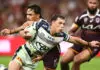 BRISBANE, AUSTRALIA - APRIL 10: Scott Drinkwater of the Cowboys is tackled during the round six NRL match between the Brisbane Broncos and North Queensland Cowboys at Suncorp Stadium on April 10, 2026 in Brisbane, Australia. (Photo by Chris Hyde/Getty Images)