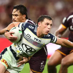 BRISBANE, AUSTRALIA - APRIL 10: Scott Drinkwater of the Cowboys is tackled during the round six NRL match between the Brisbane Broncos and North Queensland Cowboys at Suncorp Stadium on April 10, 2026 in Brisbane, Australia. (Photo by Chris Hyde/Getty Images)