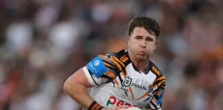 SYDNEY, AUSTRALIA - APRIL 12: Jock Madden of the Wests Tigers runs the ball during the round six NRL match between Wests Tigers and Newcastle Knights at Campbelltown Stadium on April 12, 2026 in Sydney, Australia. (Photo by Jason McCawley/Getty Images)