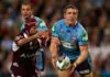 BRISBANE, AUSTRALIA - JUNE 11:  Ryan Hoffman of the Blues offloads the ball during match two of the ARL State of Origin series between the Queensland Maroons and the New South Wales Blues at Suncorp Stadium on June 11, 2008 in Brisbane,  (Photo by Cameron Spencer/Getty Images)