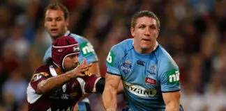 BRISBANE, AUSTRALIA - JUNE 11:  Ryan Hoffman of the Blues offloads the ball during match two of the ARL State of Origin series between the Queensland Maroons and the New South Wales Blues at Suncorp Stadium on June 11, 2008 in Brisbane,  (Photo by Cameron Spencer/Getty Images)