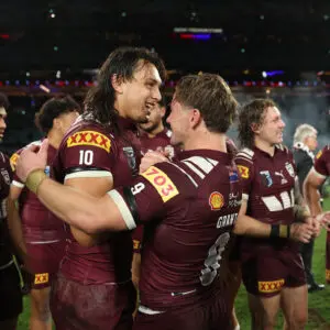 SYDNEY, AUSTRALIA - JULY 09: Tino Fa'asuamaleaui and Harry Grant of the Maroons celebrate winning game three of the Men's State Of Origin series between New South Wales Blues and Queensland Maroons at Accor Stadium on July 09, 2025 in Sydney, Australia. (Photo by Cameron Spencer/Getty Images)