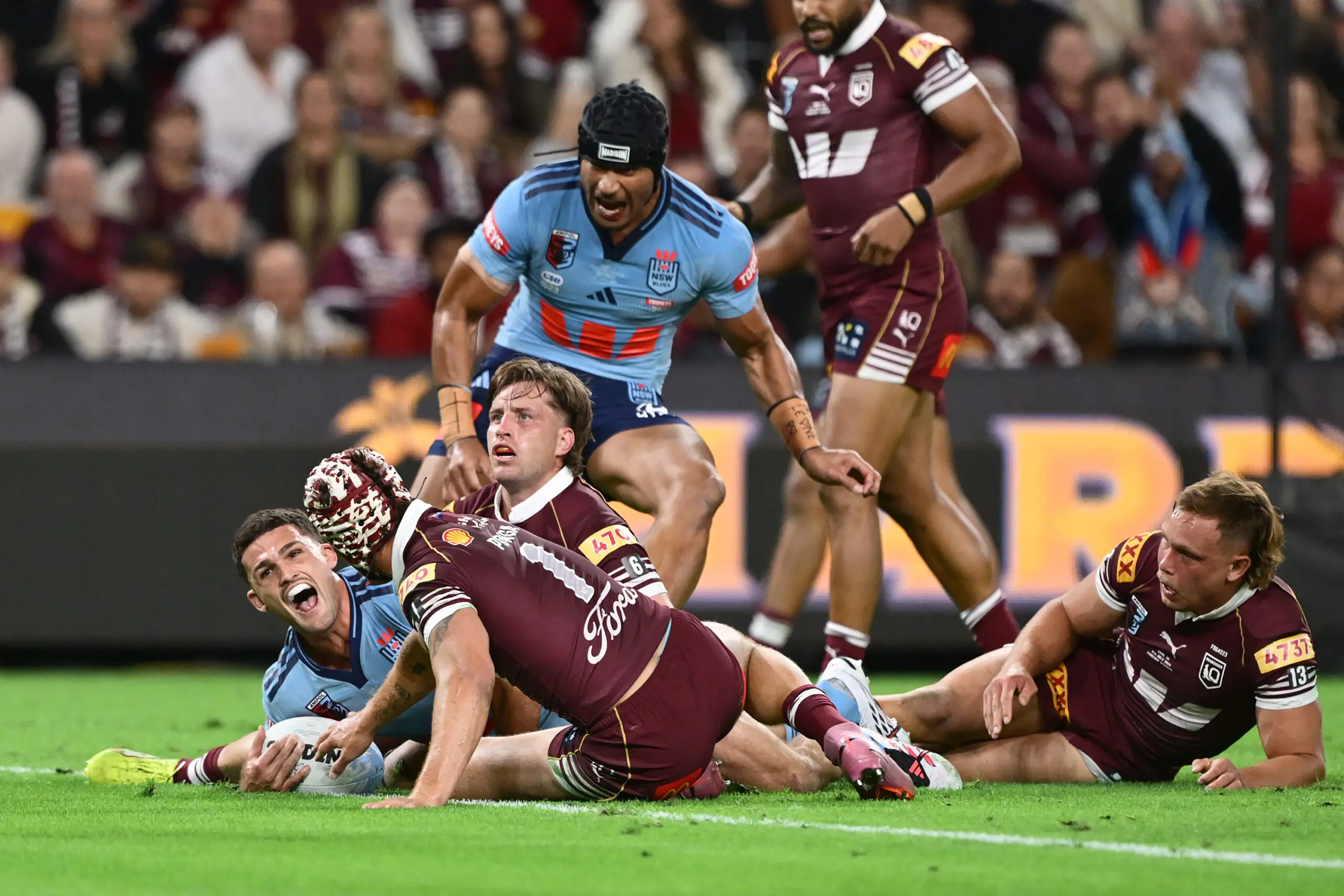BRISBANE, AUSTRALIA - JULY 08: Nathan Cleary of the Blues celebrates scoring a try during game three of the Men's State of Origin series between the Queensland Maroons and the New South Wales Blues at Suncorp Stadium on July 08, 2026 in Brisbane, Australia. (Photo by Bradley Kanaris/Getty Images)