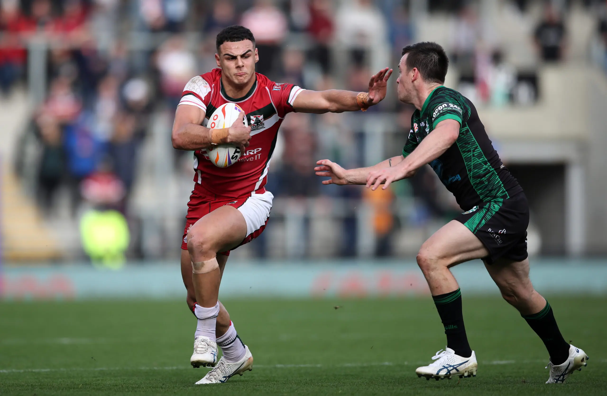 LEIGH, ENGLAND - OCTOBER 23: Jacob Kiraz of Lebanon holds off Joe Keyes of Ireland during the Rugby League World Cup 2021 Pool C match between Lebanon and Ireland at Leigh Sports Village on October 23, 2022 in Leigh, England. (Photo by Jan Kruger/Getty Images for RLWC)
