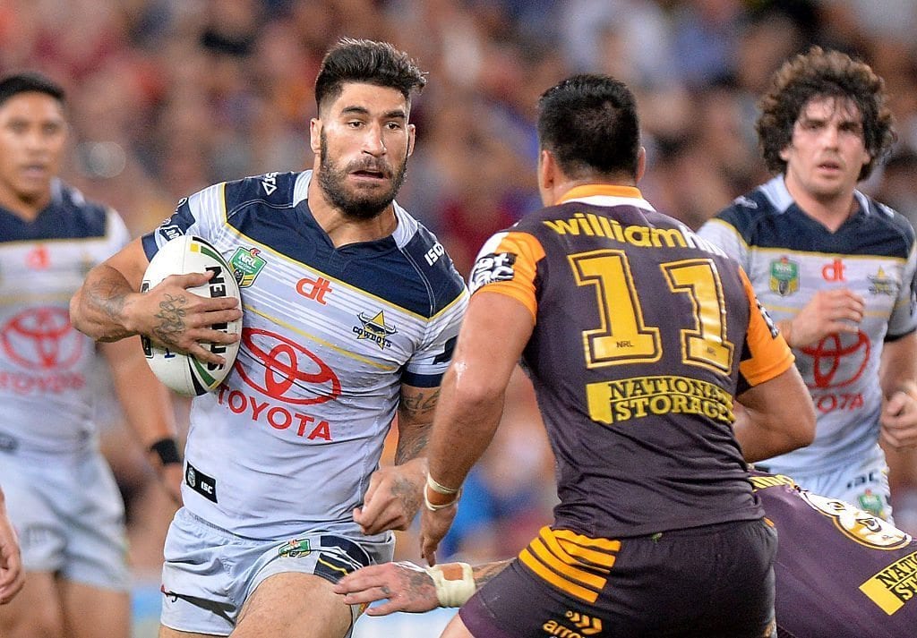 BRISBANE, AUSTRALIA - MARCH 25: James Tamou of the Cowboys looks to take on the defence during the round four NRL match between the Brisbane Broncos and the North Queensland Cowboys at Suncorp Stadium on March 25, 2016 in Brisbane, Australia. (Photo by Bradley Kanaris/Getty Images)