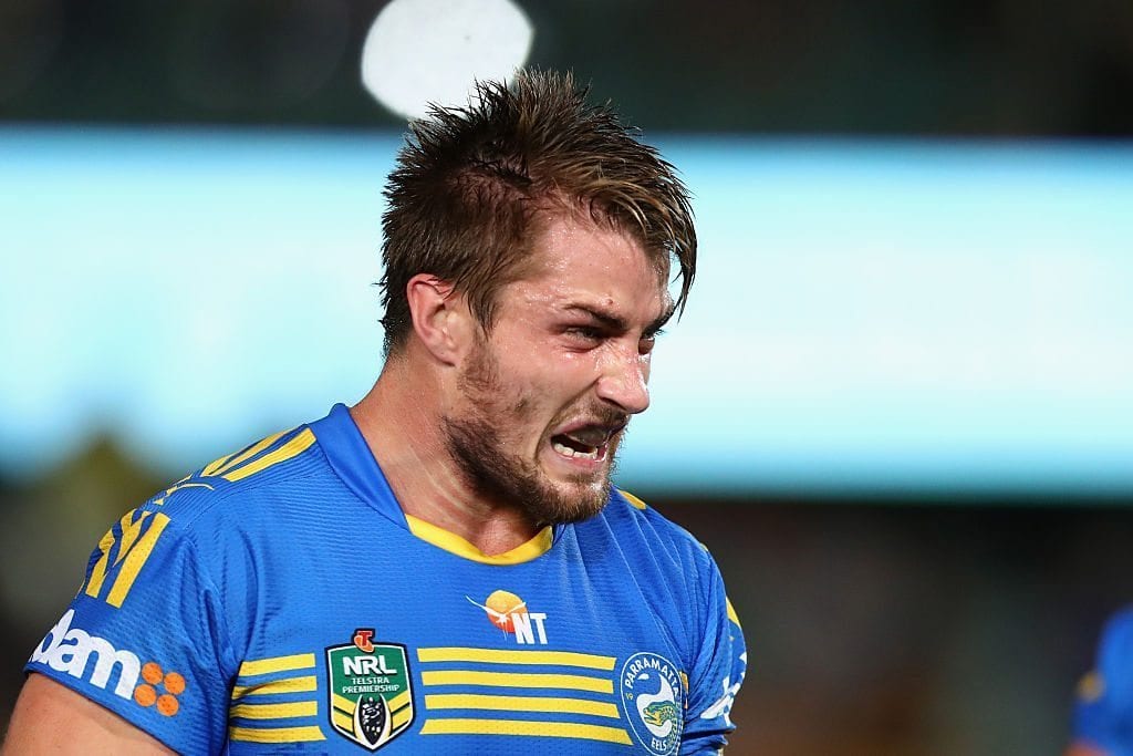 SYDNEY, AUSTRALIA - MAY 23: Kieran Foran of the Eels grimaces as he watches on during the round 11 NRL match between the Parramatta Eels and the Melbourne Storm at Pirtek Stadium on May 23, 2016 in Sydney, Australia. (Photo by Mark Kolbe/Getty Images)