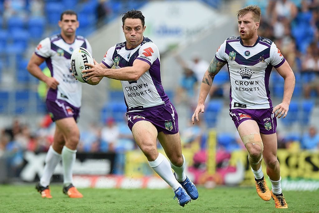 Cooper Cronk of the Storm runs with the ball during the round nine NRL match between the Gold Coast Titans and the Melbourne Storm on May 1, 2016 in Gold Coast, Australia.