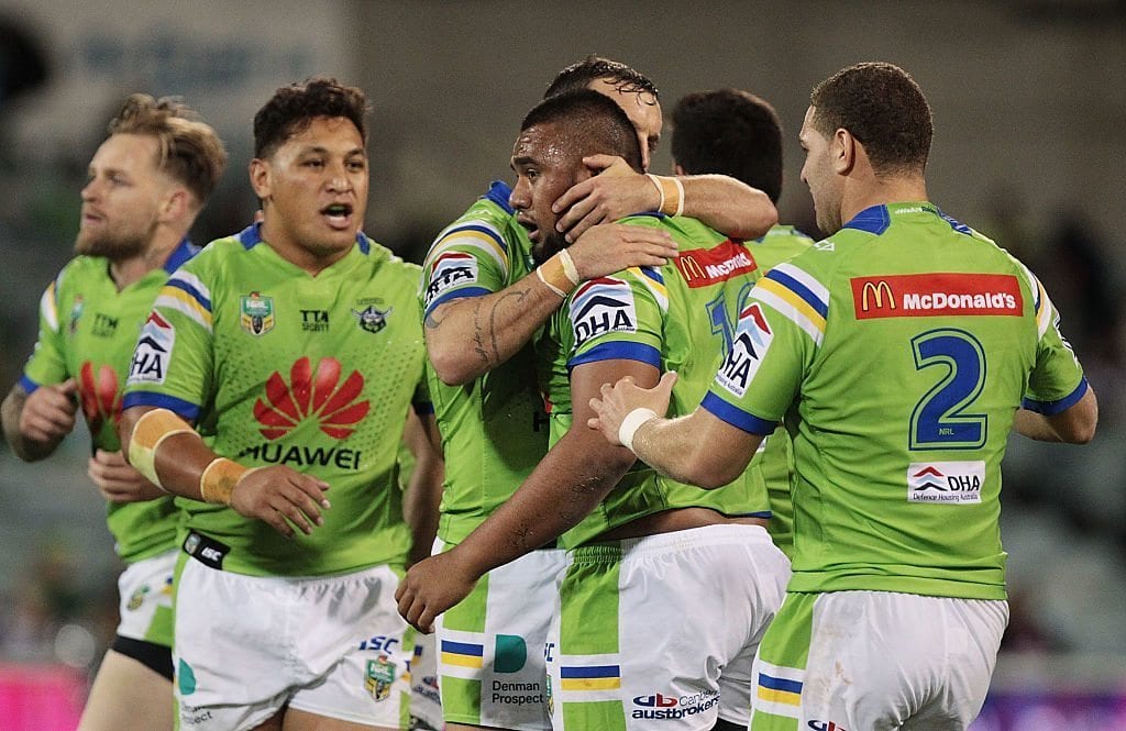 CANBERRA, AUSTRALIA - JUNE 03: Junior Paulo of the Raiders is congratulated by team mates during the round 13 NRL match between the Canberra Raiders and the Manly Sea Eagles at GIO Stadium on June 3, 2016 in Canberra, Australia. (Photo by Stefan Postles/Getty Images)