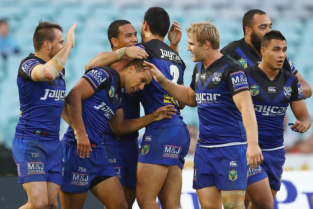 SYDNEY, AUSTRALIA - JUNE 13: Moses Mbye of the Bulldogs celebrates with his team mates after scoring a try during the round 14 NRL match between the St George Illawarra Dragons and the Canterbury Bulldogs at ANZ Stadium on June 13, 2016 in Sydney, Australia. (Photo by Mark Kolbe/Getty Images)
