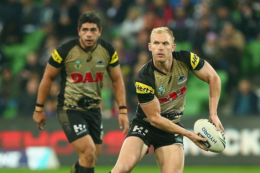 MELBOURNE, AUSTRALIA - JUNE 04:  Peter Wallace of the Panthers offloads the ball during the round 13 NRL match between the Melbourne Storm and the Penrith Panthers at AAMI Park on June 4, 2016 in Melbourne, Australia.  (Photo by Robert Prezioso/Getty Images)