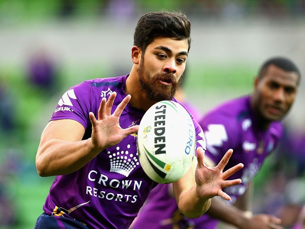 MELBOURNE, AUSTRALIA - JUNE 26:  Young Tonumaipea of the Storm receives the ball during warm up prior to the round 16 NRL match between the Melbourne Storm and Wests Tigers at AAMI Park on June 26, 2016 in Melbourne, Australia.  (Photo by Robert Prezioso/Getty Images)