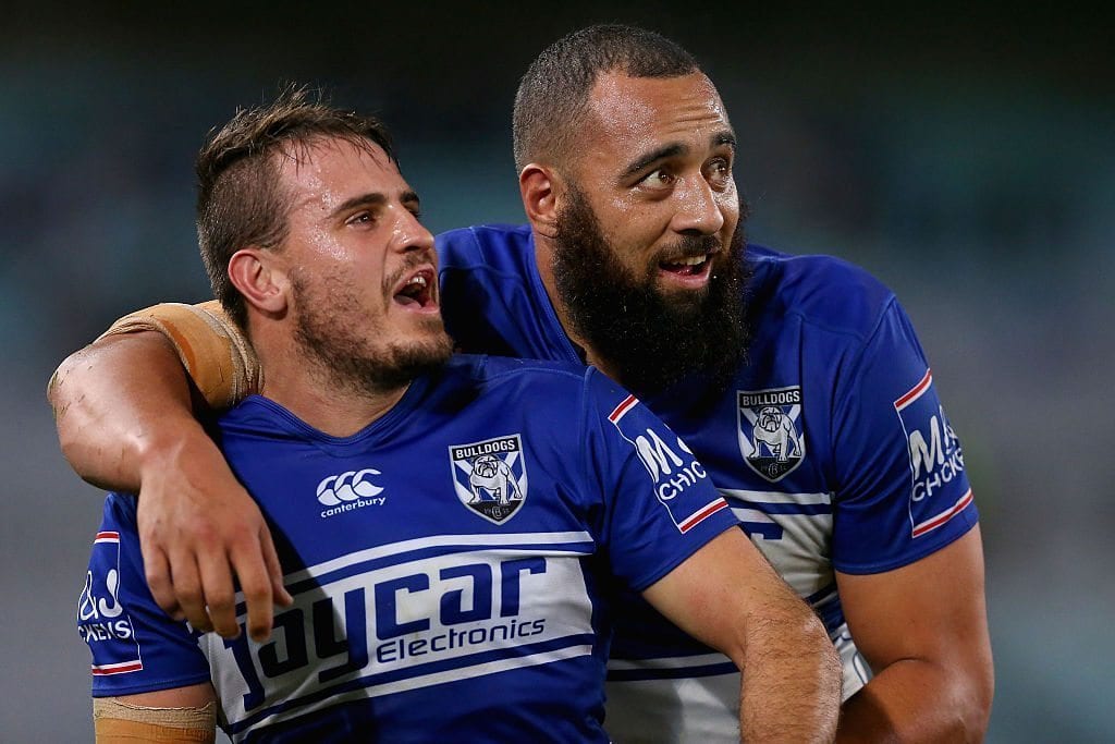SYDNEY, AUSTRALIA - JULY 09: Josh Reynolds and Sam Kasiano of the Bulldogs celebrate victory at the end of the round 18 NRL match between the Canterbury Bulldogs and the Wests Tigers at ANZ Stadium on July 9, 2016 in Sydney, Australia. (Photo by Jason McCawley/Getty Images)