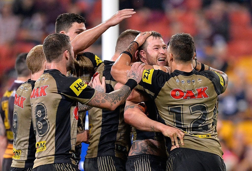 BRISBANE, AUSTRALIA - JULY 22: Trent Merrin of the Panthers is congratulated by team mates after scoring a try during the round 20 NRL match between the Brisbane Broncos and the Penrith Panthers at Suncorp Stadium on July 22, 2016 in Brisbane, Australia. (Photo by Bradley Kanaris/Getty Images)