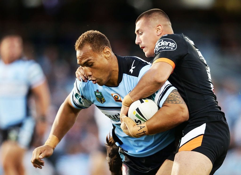 SYDNEY, NEW SOUTH WALES - APRIL 02: Sam Tagataese of the Sharks is tackled during the round five NRL match between the Wests Tigers and the Cronulla Sharks at Campbelltown Sports Stadium on April 2, 2016 in Sydney, Australia. (Photo by Matt King/Getty Images)