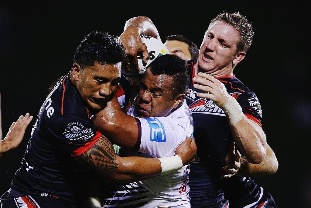 AUCKLAND, NEW ZEALAND - APRIL 09: Siosaia Vave of the Sea Eagles is tackled by Albert Vete of the Warriors and Ryan Hoffman of the Warriors during the round six NRL match between the New Zealand Warriors and the Manly Sea Eagles at Mt Smart Stadium on April 9, 2016 in Auckland, New Zealand. (Photo by Hannah Peters/Getty Images)
