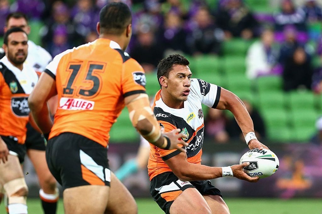 MELBOURNE, AUSTRALIA - JUNE 26: Elijah Taylor of the Tigers offloads during the round 16 NRL match between the Melbourne Storm and Wests Tigers at AAMI Park on June 26, 2016 in Melbourne, Australia. (Photo by Robert Prezioso/Getty Images)