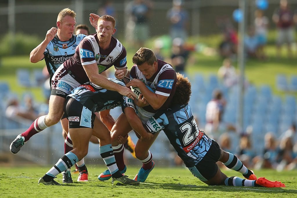 SYDNEY, AUSTRALIA - FEBRUARY 14: Luke Lewis of the Sharks and Tom Symonds of the Eagles collide as Liam Knight of the Eagles is tackled during the NRL Trial match between the Cronulla Sharks and the Manly Sea Eagles at Remondis Stadium on February 14, 2016 in Sydney, Australia. (Photo by Mark Kolbe/Getty Images)