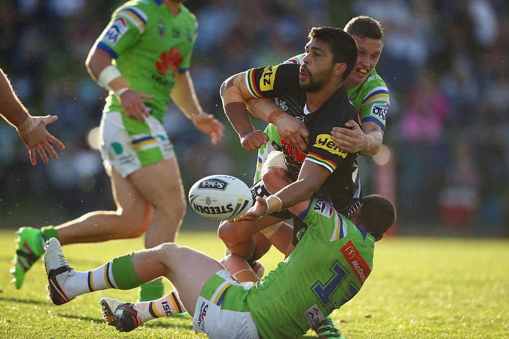 BATHURST, AUSTRALIA - APRIL 30: Tyrone Peachey of the Panthers passes as he is tackled during the round nine NRL match between the Penrith Panthers and the Canberra Raiders at Carrington Park on April 30, 2016 in Bathurst, Australia. (Photo by Mark Kolbe/Getty Images)