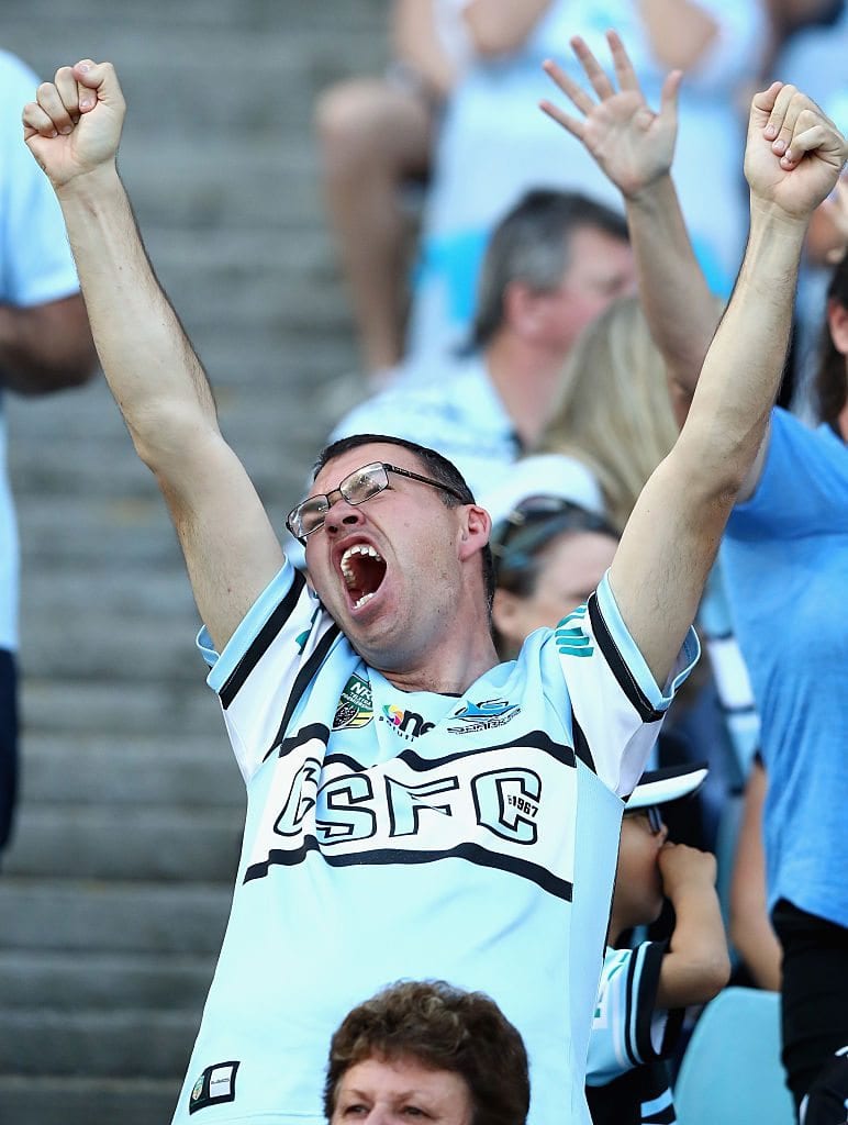 SYDNEY, AUSTRALIA - OCTOBER 02: Sharks fans cheer during the 2016 NRL Grand Final match between the Cronulla Sutherland Sharks and the Melbourne Storm at ANZ Stadium on October 2, 2016 in Sydney, Australia. (Photo by Ryan Pierse/Getty Images)