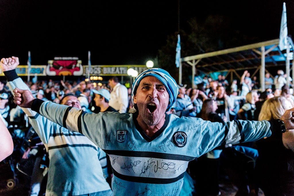 SYDNEY, NEW SOUTH WALES - OCTOBER 02: Cronulla Sharks fans at Southern Cross Group Stadium celebrate the Sharks' victory in the 2016 NRL Grand Final on October 2, 2016 in Sydney, Australia. (Photo by Brook Mitchell/Getty Images)