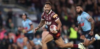 SYDNEY, AUSTRALIA - JUNE 05: Hamiso Tabuai-Fidow of the Maroons runs the ball to score a try during game one of the 2024 Men's State of Origin Series between New South Wales Blues and Queensland Maroons at Accor Stadium on June 05, 2024 in Sydney, Australia. (Photo by Matt King/Getty Images)