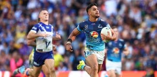BRISBANE, AUSTRALIA - MAY 04: Alofiana Khan-Pereira of the Titans makes a break to score a try during the round nine NRL match between the Gold Coast Titans and Canterbury Bulldogs at Suncorp Stadium on May 04, 2025, in Brisbane, Australia. (Photo by Chris Hyde/Getty Images)