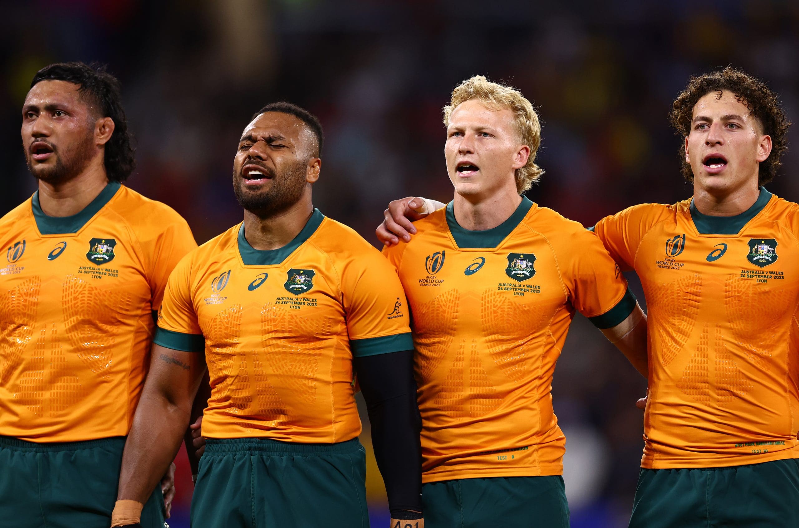 LYON, FRANCE - SEPTEMBER 24: Robert Leota, Samu Kerevi, Carter Gordon, Mark Nawaqanitawase of Australia line up during the National Anthems prior to the Rugby World Cup France 2023 match between Wales and Australia at Parc Olympique on September 24, 2023 in Lyon, France. (Photo by Chris Hyde/Getty Images)
